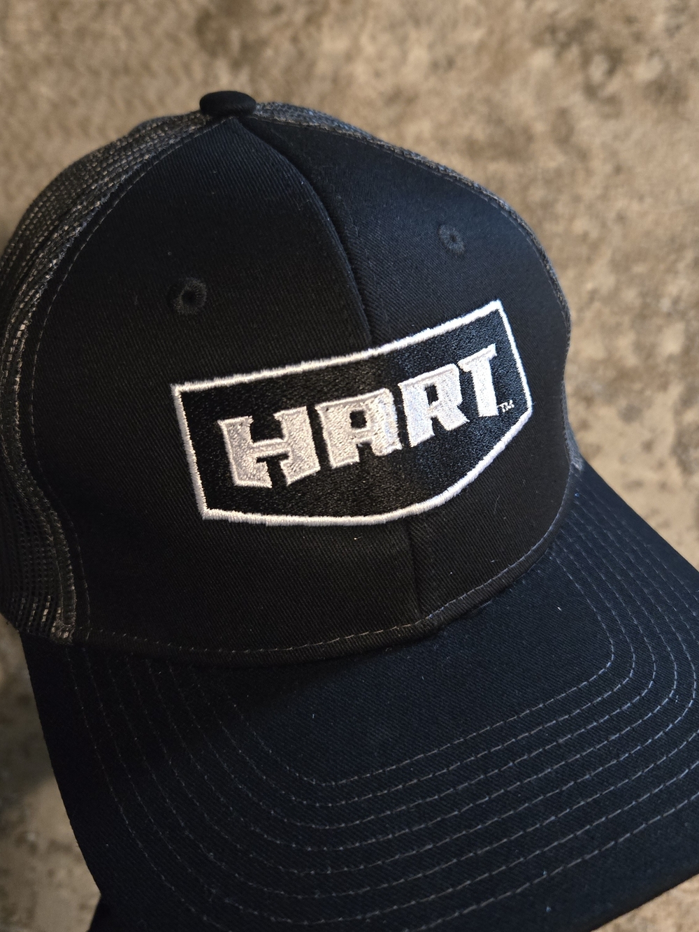 Port Authority black cap with white embroidered Hart logo
